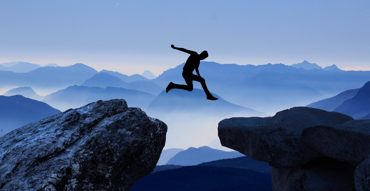 Man Jumping Over the Mountains